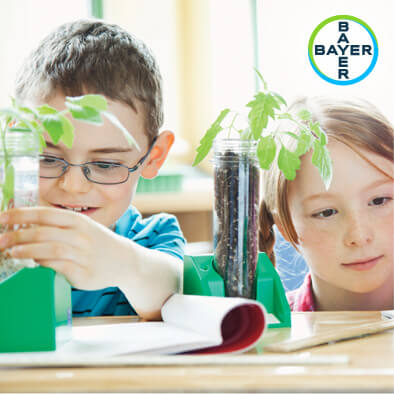 Bayer logo and kids with plants